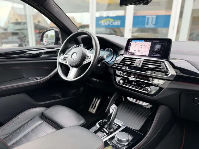 BMW X4 M 2019 vor dem Showroom von Raf Cars in Ninove-Outer, Foto 17
